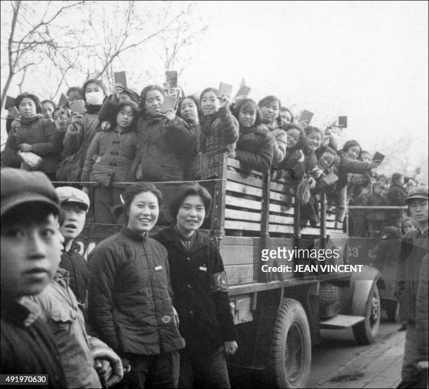 The propaganda squad of Red Guards, high school and university students, brandishing the copies of Chairman Mao Zedong's "Little Red Book," parade in...