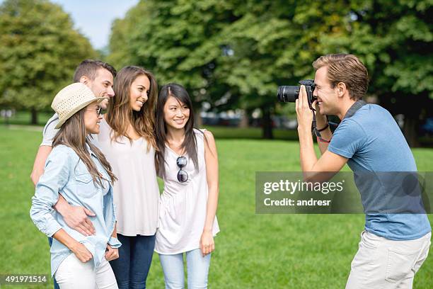 photographer taking pictures to a group of friends - food photoshoot stock pictures, royalty-free photos & images