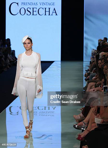 Model walks the runway during the show by Cosecha Prendas Vintage of Argentina at Miami Fashion Week Resort 2014/2015 Day 3 at Miami Beach Convention...
