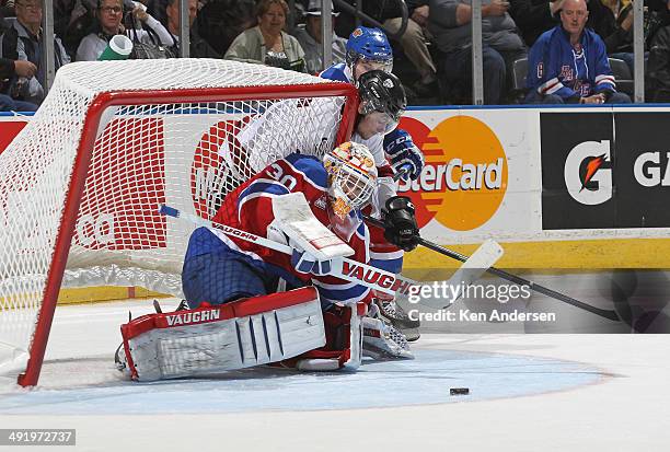 With the net falling over Tristan Jarry of the Edmonton Oil Kings reaches to make a save against the Guelph Storm in Game Two of the 2014 Mastercard...