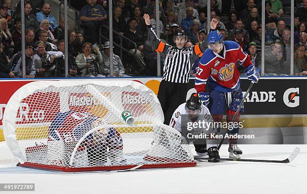 Tristan Jarry of the Edmonton Oil Kings appears to be caged against the Guelph Storm in Game Two of the 2014 Mastercard Memorial Cup at Budweiser...