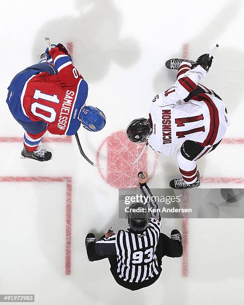 Jason Dickinson of the Guelph Storm takes a faceoff against Henrik Samuelsson of the Edmonton Oil Kings in Game Two of the 2014 Mastercard Memorial...