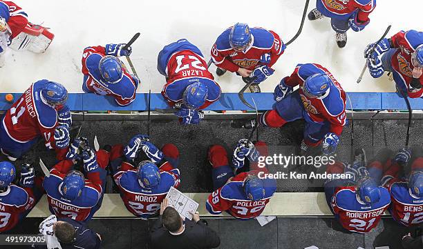 Head coach Derek Laxdal of the Edmonton Oil Kings goes over a play during a timeout against the Guelph Storm in Game Two of the 2014 Mastercard...