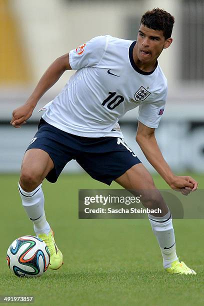 Dominic Solanke of England runs with the ball during the UEFA Under17 European Championship 2014 semi final match between Portugal and England at Ta'...