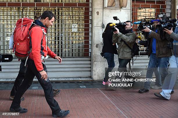 Former French trader Jerome Kerviel , and French priest Patrice Gourrier ar filmed by reporters in Vintimille , on their way to enter France from...