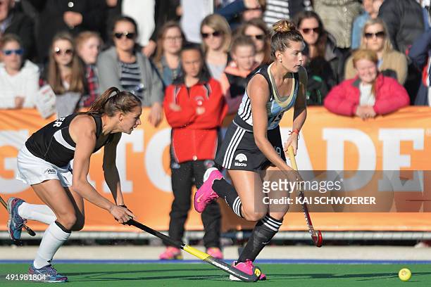 Agustina Albertario of Argentina runs with the ball during the international women's hockey test match between the New Zealand Black Sticks and the...
