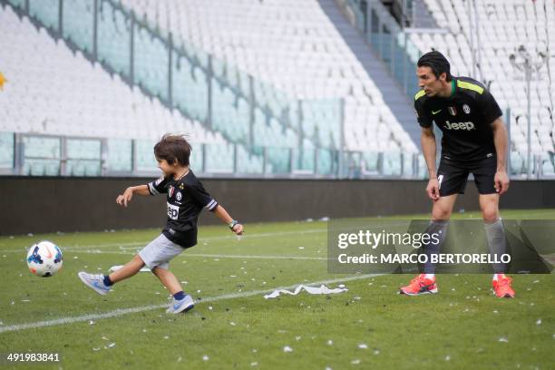 Juventus' goalkeeper Gianluigi Buffon plays with his son after the Italian Serie A football match Juventus vs Cagliari and the trophy ceremony of the...