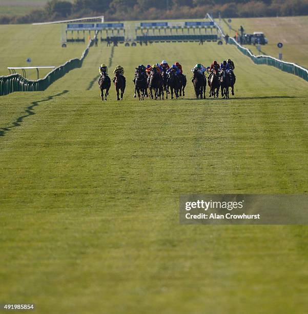 General view as runners make their way down the Rowley mile course at Newmarket racecourse on October 09, 2015 in Newmarket, England.