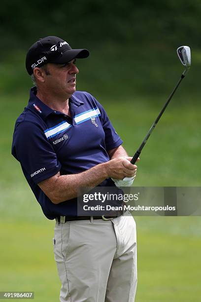 Paul McGinley of Ireland hits his second shot on the 1st hole during the final round of the Open de Espana held at PGA Catalunya Resort on May 18,...