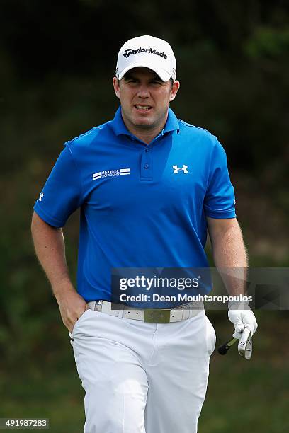 Richie Ramsay of Scotland looks on after he hits his second shot on the 1st hole during the final round of the Open de Espana held at PGA Catalunya...