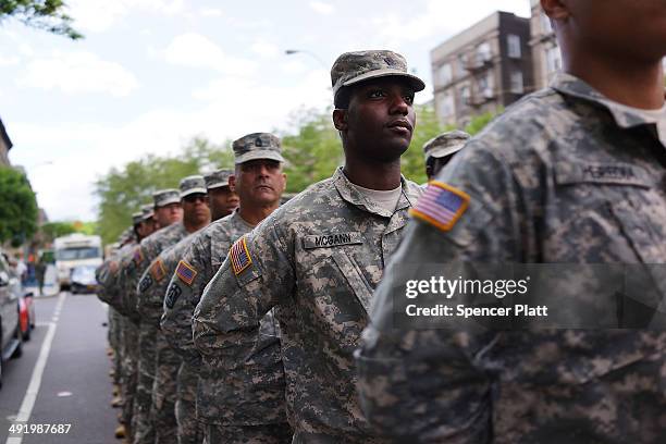 Memebrs of the Army's 369th Infantry Regiment prepare to march with fellow soldiers, boy scouts and various other military aligned groups in the...