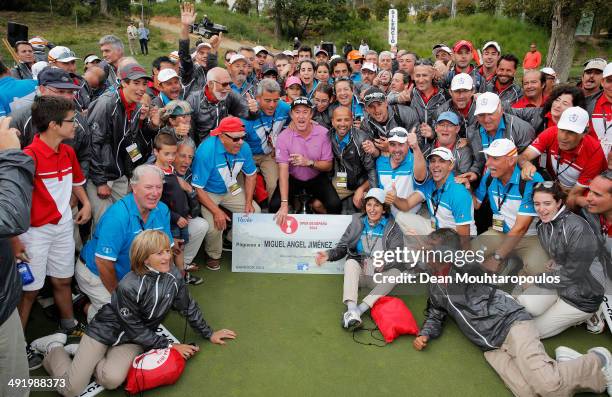 Miguel Angel Jimenez celebrates with the the marshalls after winning the Open de Espana held at PGA Catalunya Resort on May 18, 2014 in Girona, Spain.