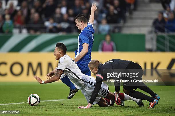 Davie Selke of Germany is challenged by Daniel O'Shaughnessy and Otso Virtanen of Finland during the 2017 UEFA European U21 Championships Qualifier...