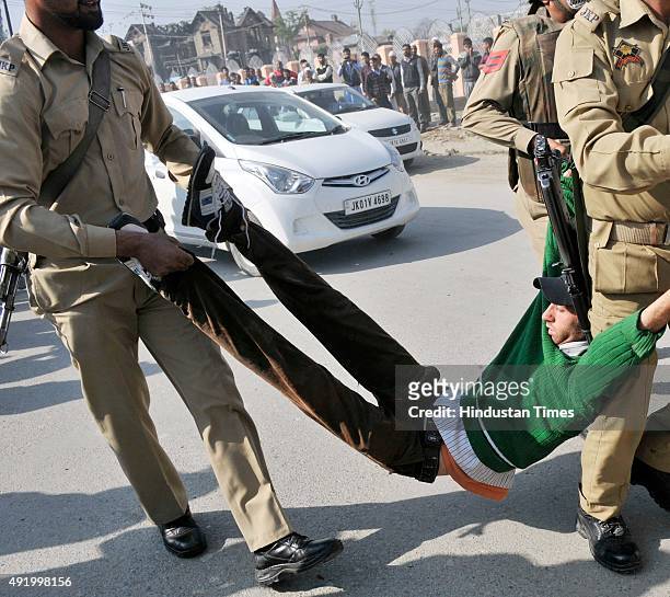 Supporter of Independent legislator Engineer Rashid detained by police during a protest march on October 9, 2015 in Srinagar, India. Police detained...