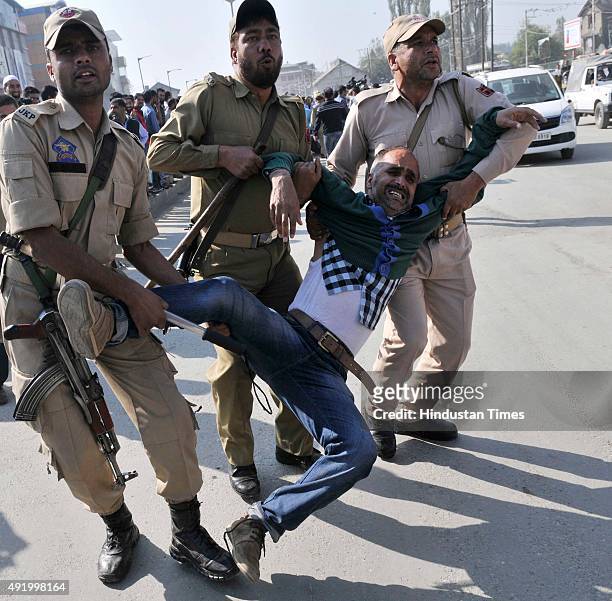 Supporter of Independent legislator Engineer Rashid detained by police during a protest march on October 9, 2015 in Srinagar, India. Police detained...
