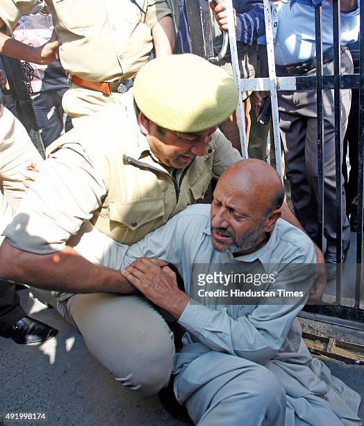 Independent Legislator Engineer Rashid detained outside Secretariat gate during a protest march on October 9, 2015 in Srinagar, India. Police...