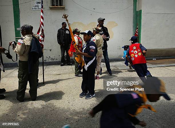 Boy Scouts prepare to march with soldiers, veterans and various other military aligned groups in the 369th Infantry Regiment Parade in Harlem on May...