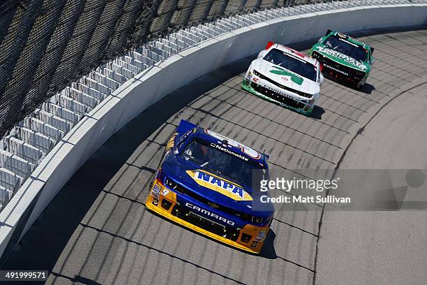 Chase Elliott, driver of the NAPA Auto Parts Chevrolet, leads Dylan Kwasniewski, driver of the Up&Up Chevrolet, during the NASCAR Nationwide Series...