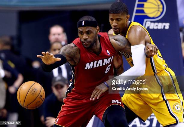 Paul George of the Indiana Pacers defends against LeBron James of the Miami Heat during Game One of the Eastern Conference Finals of the 2014 NBA...