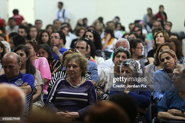 Syrian Refugees listen as Cardinal Rodríguez Maradiaga of Honduras and President of the International Caritas, accompanied with forty personalities...