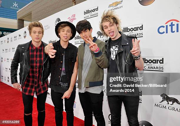 Recording artists Luke Hemmings, Ashton Irwin, Calum Hood and Michael Clifford of 5 Seconds of Summer attend the 2014 Billboard Music Awards at the...