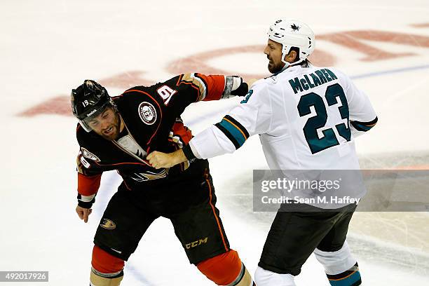 Patrick Maroon of the Anaheim Ducks and Frazer McLaren of the San Jose Sharks fight in the third period of a preseason game at Honda Center on...