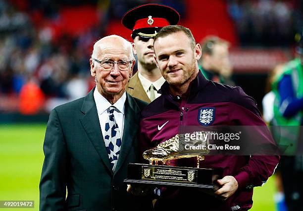 Wayne Rooney of England is presented with the Golden Boot by Sir Bobby Charlton after breaking his record of 49 goals prior to the UEFA EURO 2016...