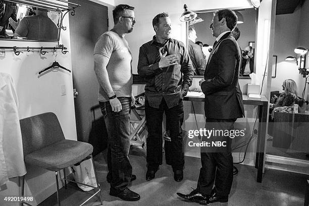 Episode 272 -- Pictured: Baseball analyst, Sean Casey and Kevin Millar, talk with host Seth Meyers backstage on October 8, 2015 --