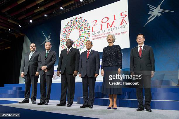 In this handout image provided by the International Monetary Fund, Mahmoud Mohieldin , World Bank, Jim Yong Kim, President, World Bank, Kordja...