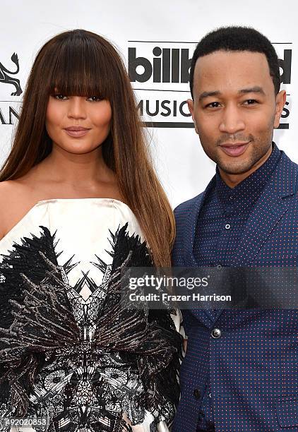 Model Christine Teigen and musician John Legend attend the 2014 Billboard Music Awards at the MGM Grand Garden Arena on May 18, 2014 in Las Vegas,...