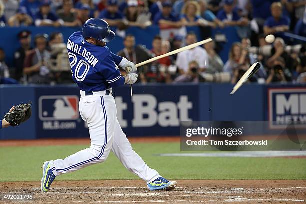 Josh Donaldson of the Toronto Blue Jays breaks his bat in the eighth inning against the Texas Rangers during game two of the American League Division...