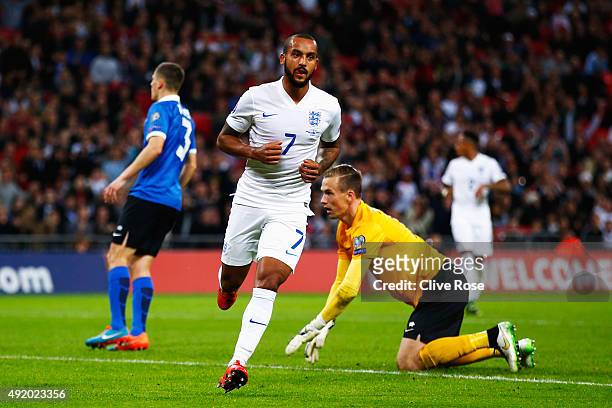 Theo Walcott of England celebrates scoring during the UEFA EURO 2016 Group E qualifying match between England and Estonia at Wembley on October 9,...