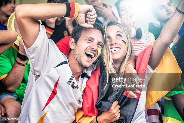 germany supporters in the stadium - german culture stock pictures, royalty-free photos & images