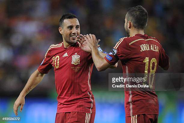 Santi Cazorla of Spain celebrates with Jordi Alba after scoring Spain's opening goal during the UEFA EURO 2016 Qualifier group C match between Spain...