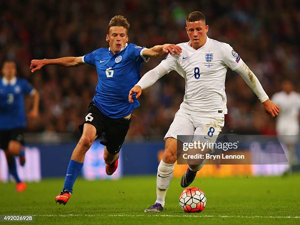 Aleksandr Dmitrijev of Estonia and Ross Barkley of England challenge for the ball during the UEFA EURO 2016 Group E qualifying match between England...