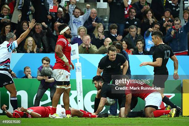 Nehe Milner-Skudder of the New Zealand All Blacks scores their third try during the 2015 Rugby World Cup Pool C match between New Zealand and Tonga...