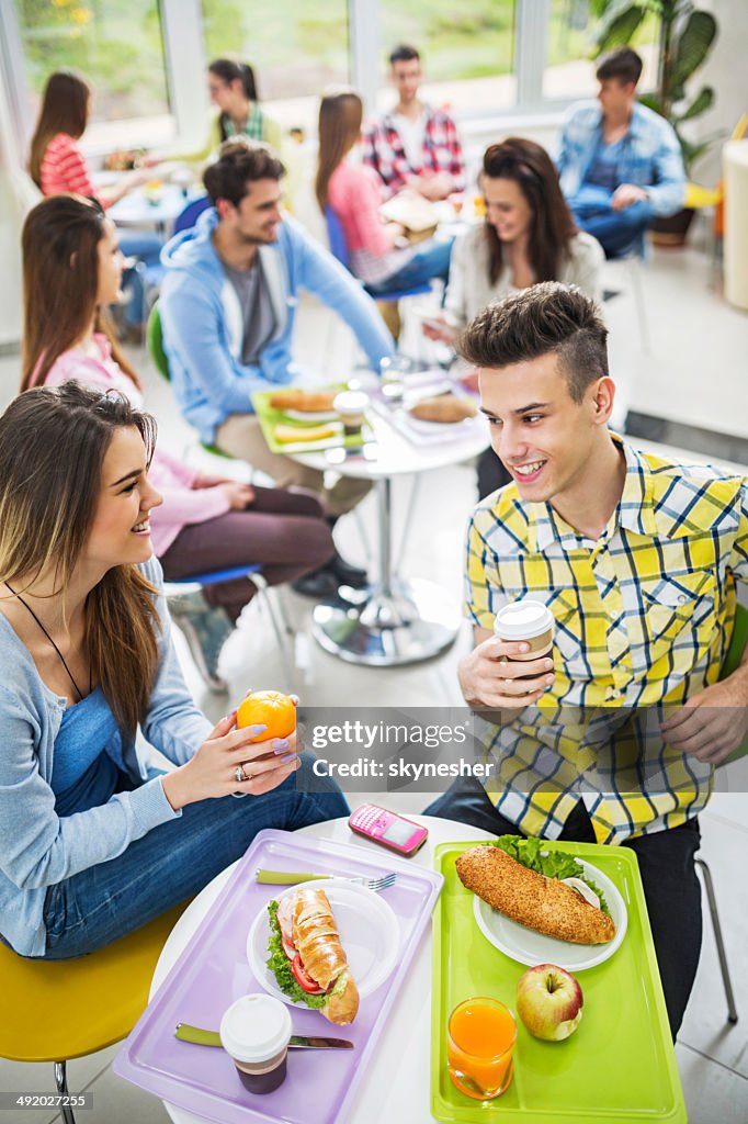 Young couple in a cafeteria.