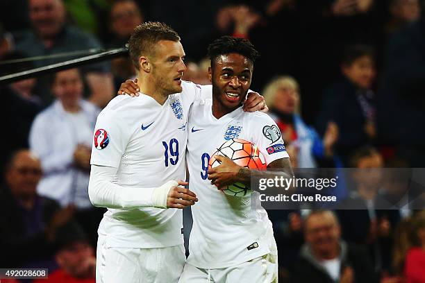 Raheem Sterling of England celebrates with Jamie Vardy as he scores their second goal during the UEFA EURO 2016 Group E qualifying match between...