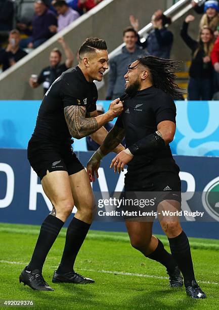 Ma'a Nonu of the New Zealand All Blacks celebrates with Sonny Bill Williams after scoring their seventh try during the 2015 Rugby World Cup Pool C...