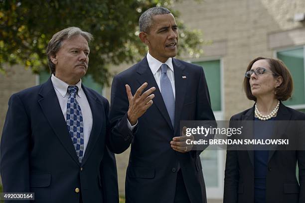 Roseburg Mayor Larry Rich and Oregon Governor Kate Brown listen while US President Barack Obama makes a statement to the press after meeting with the...
