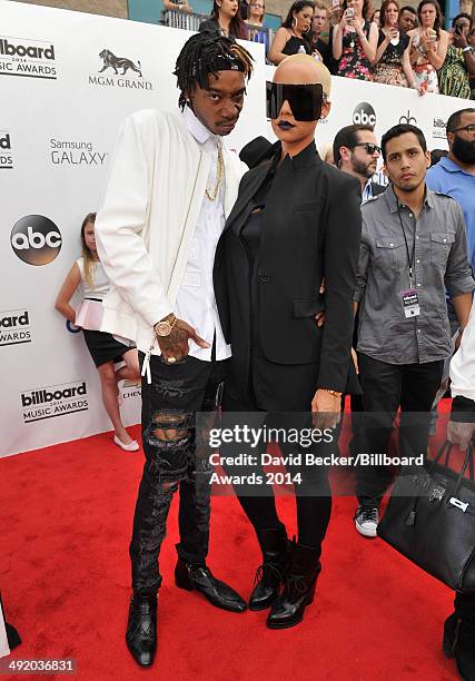 Model Amber Rose and recording artist Wiz Khalifa attend the 2014 Billboard Music Awards at the MGM Grand Garden Arena on May 18, 2014 in Las Vegas,...