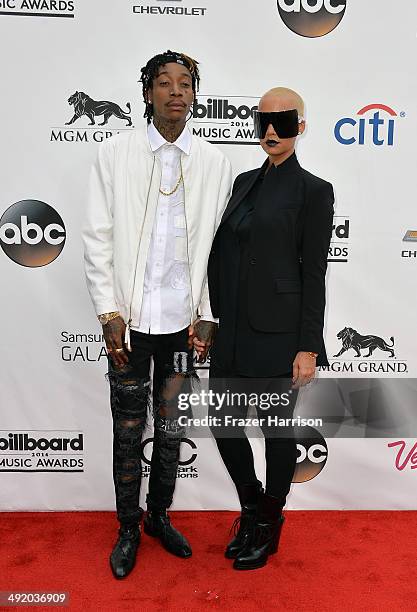 Rapper Wiz Khalifa and model Amber Rose attend the 2014 Billboard Music Awards at the MGM Grand Garden Arena on May 18, 2014 in Las Vegas, Nevada.