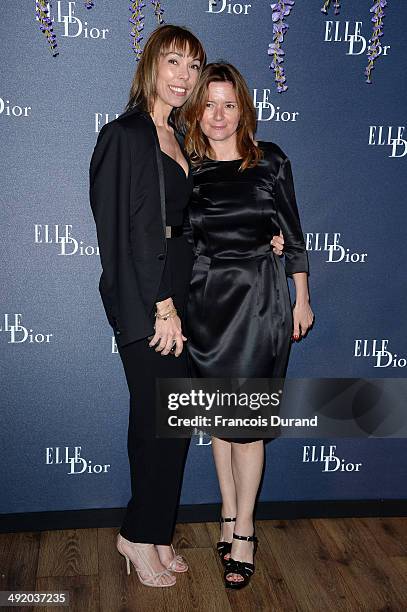 Mathilde Meyer and a guest attend the Dior & ELLE Magazine Dinner at the 67th Annual Cannes Film Festival at Albane by Costes, JW Marriott Rooftop on...