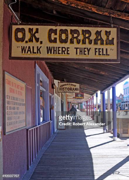 Board sidewalks line the main street in historic Tombstone, Arizona, known as 'The Town Too Tough to Die.' The town, featuring staged gunfights and...
