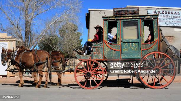 Stagecoach takes paying customers on a horse-drawn tour of historic Tombstone, Arizona, known as 'The Town Too Tough to Die.' The town, featuring...