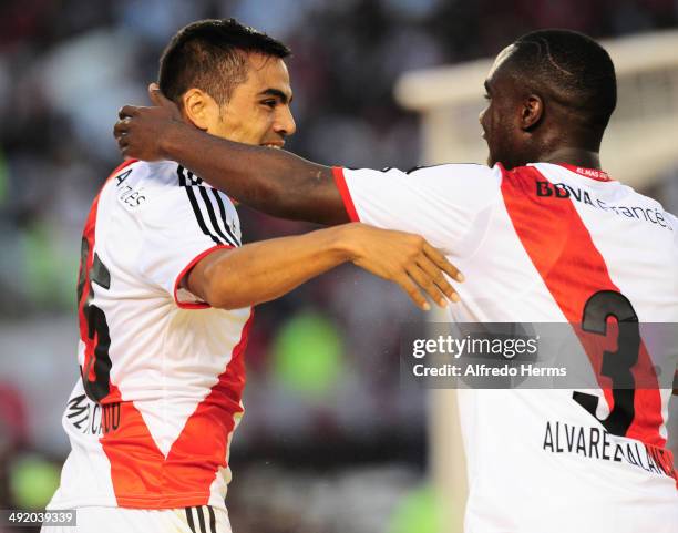 Gabriel Mercado celebrates with Eder Alvarez Balanta after scoring the third goal of his team during a match between River Plate and Quilmes as part...
