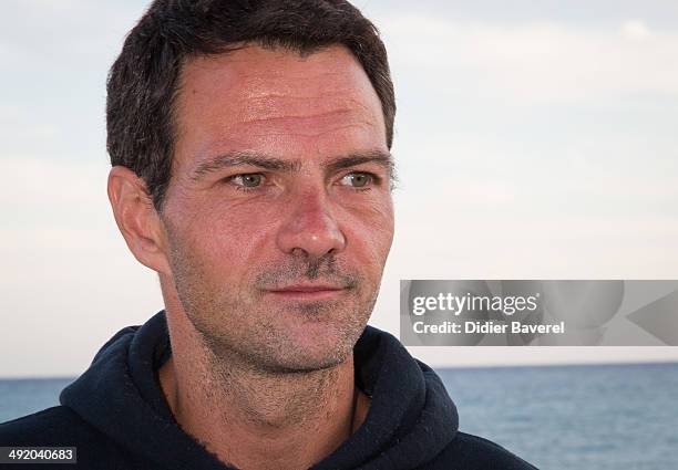 Former Societe General trader Jerome Kerviel poses for a photo on his way to the French border to surrender to police on May 18, 2014 in Menton,...