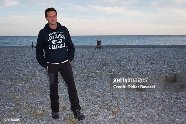 Former Societe General trader Jerome Kerviel poses for a photo on his way to the French border to surrender to police on May 18, 2014 in Menton,...