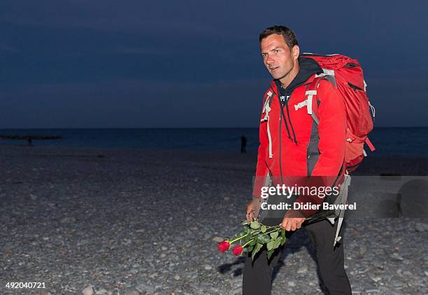 Former Societe General trader Jerome Kerviel walks to the French border to surrender to police on May 18, 2014 in Menton, France. Kerviel, convicted...