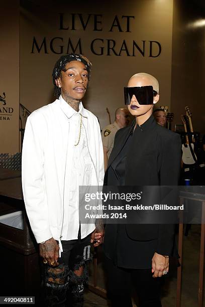 Model Amber Rose and recording artist Wiz Khalifa attend the 2014 Billboard Music Awards at the MGM Grand Garden Arena on May 18, 2014 in Las Vegas,...